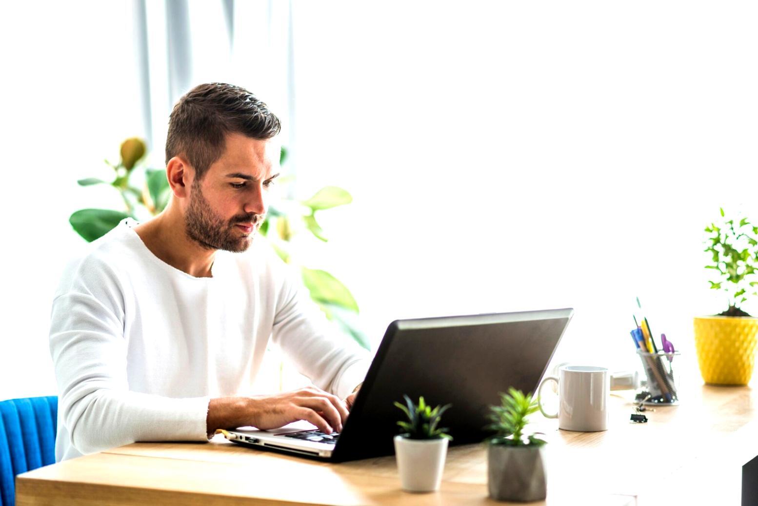 Detailed financial planning session with spreadsheets and business documents spread across a conference table