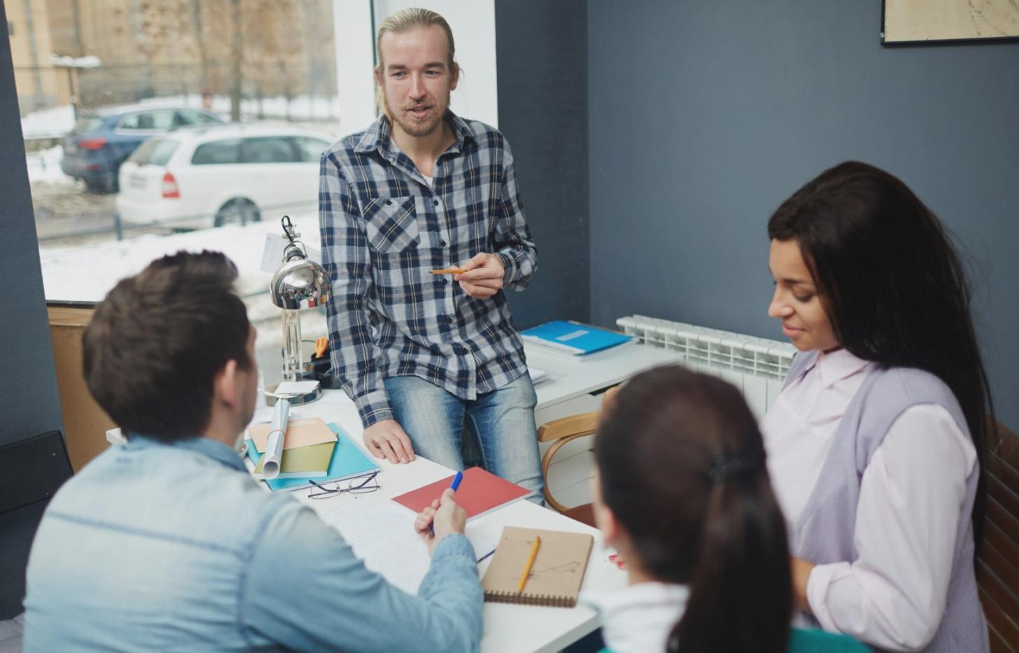 Business professionals analyzing growth charts and financial data in a modern office setting